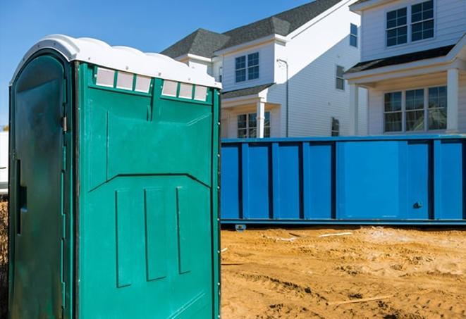 row of portable toilets providing essential facilities at a work site